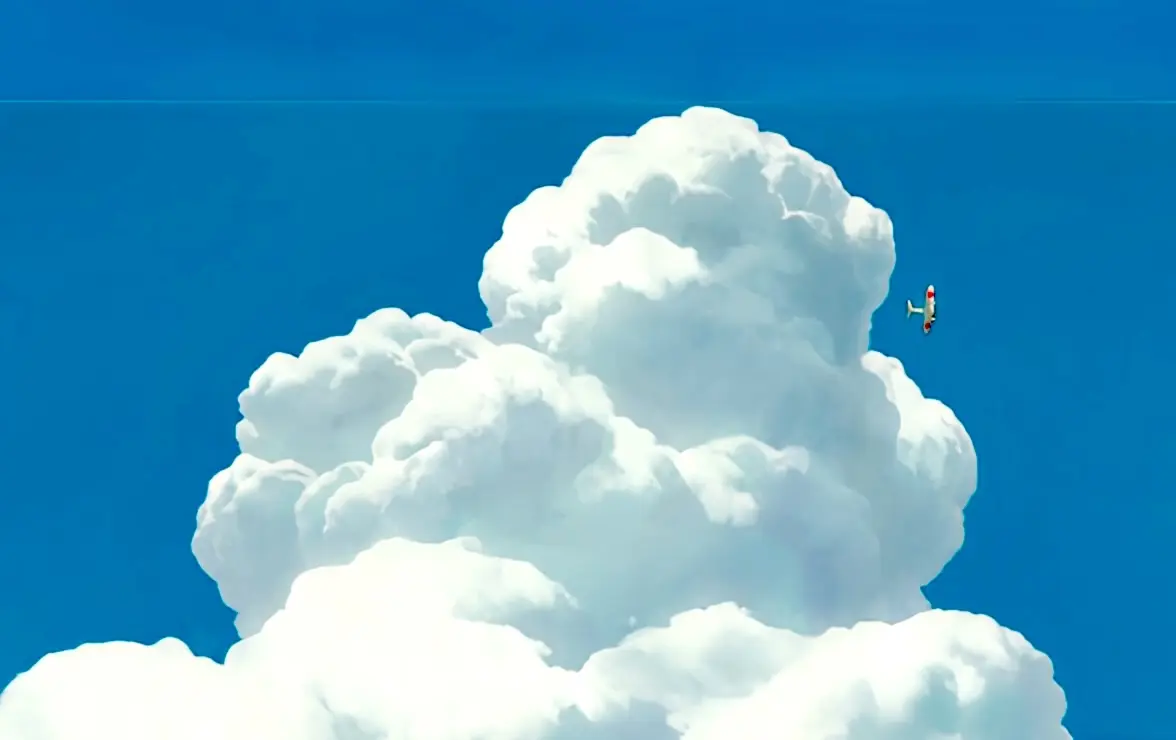 A tiny plane flying through towering clouds